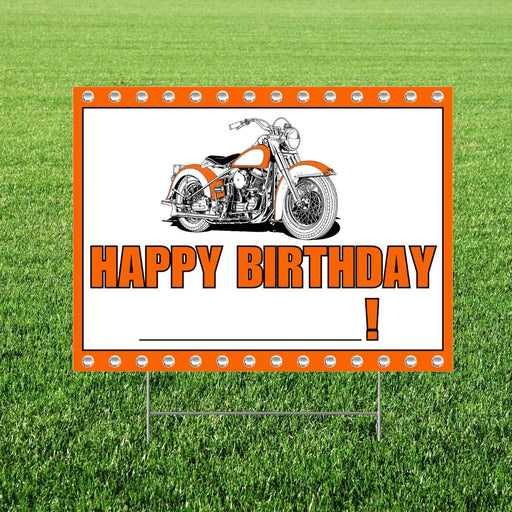 Birthday sign with motorcycle graphic and 'Happy Birthday!' text on a grass background