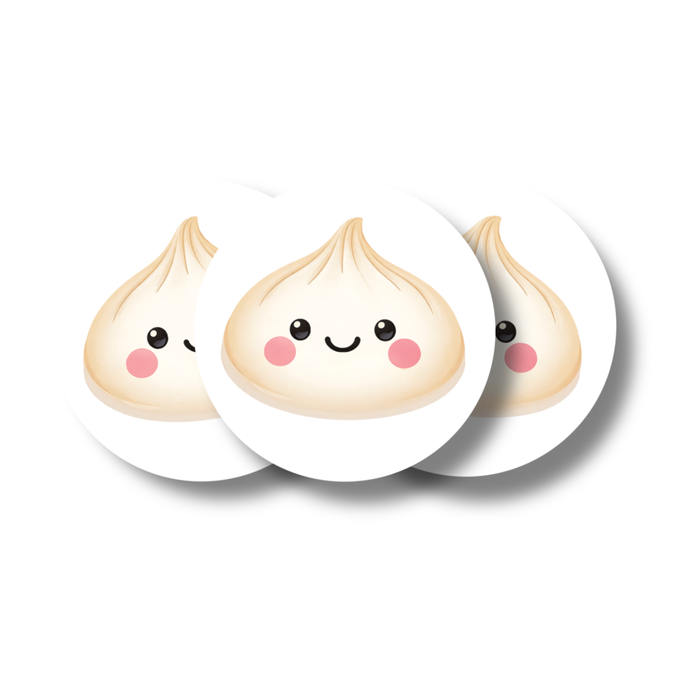 Round paper confetti pieces featuring a cute smiling dumpling design with rosy cheeks, shown in a small stacked arrangement on a white background.