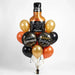 Aged to Perfection birthday balloon bouquet featuring a bottle-shaped “Aged to Perfection” foil balloon, two black “Happy Birthday” foil balloons, and black, burnt orange, and gold latex balloons with curling ribbons.