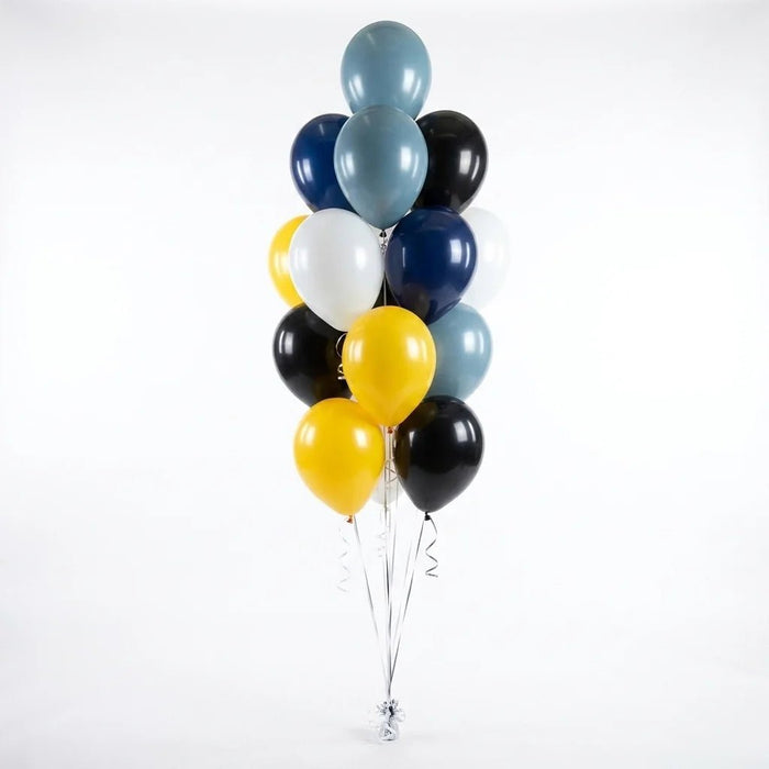 Navy, black, yellow, white, and slate blue balloon bouquet featuring latex balloons gathered with curling ribbons.