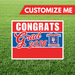 Graduation-themed customizable sign with 'Congrats Grad 2026' on a grass background