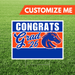 Graduation-themed sign with 'Congrats Grad '26' text and a horse logo on grass.