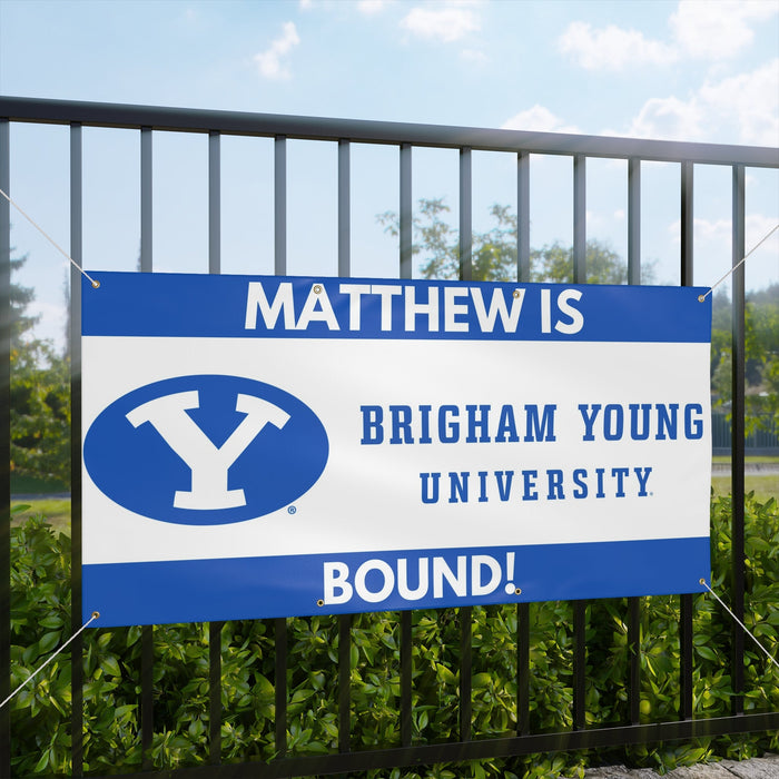 Banner with 'Matthew is Brigham Young University Bound!' text and BYU logo on a fence.