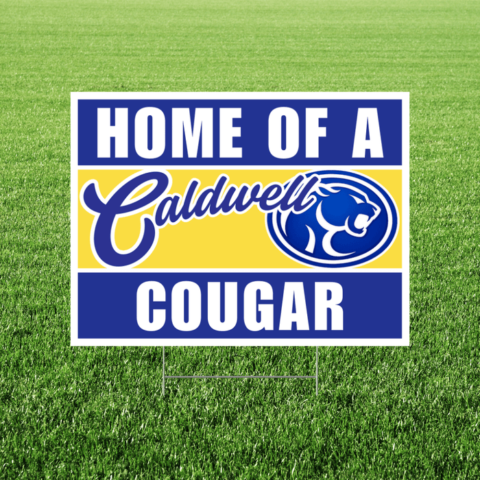 Sign with 'Home of a Caldwell Cougar' text on a grass background