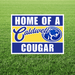 Sign with 'Home of a Caldwell Cougar' text on a grass background