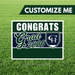Graduation-themed customizable sign with 'Congrats Grad 2026' text on a grass background