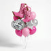 Disco cowgirl balloon bouquet featuring pink cowgirl boot-shaped foil balloons, a disco ball-patterned foil balloon, a silver star-shaped foil balloon, and light pink, hot pink, and silver latex balloons with curling ribbons.