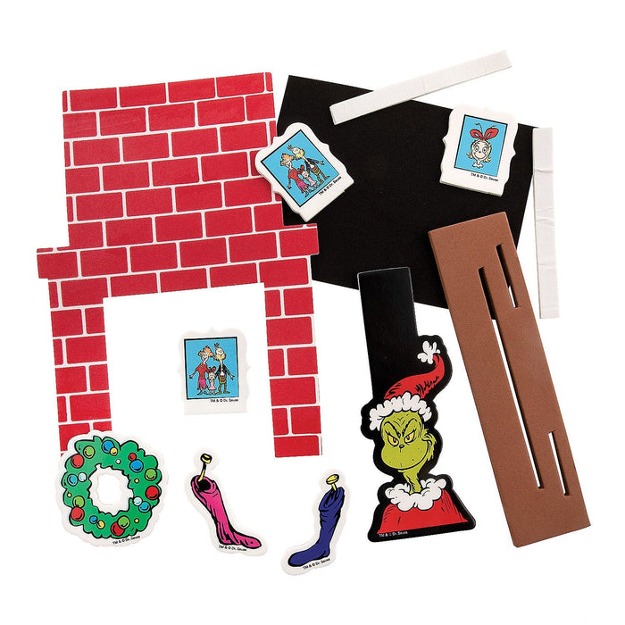 The contents of a Dr. Seuss™ The Grinch Fireplace Craft Kit Pack.