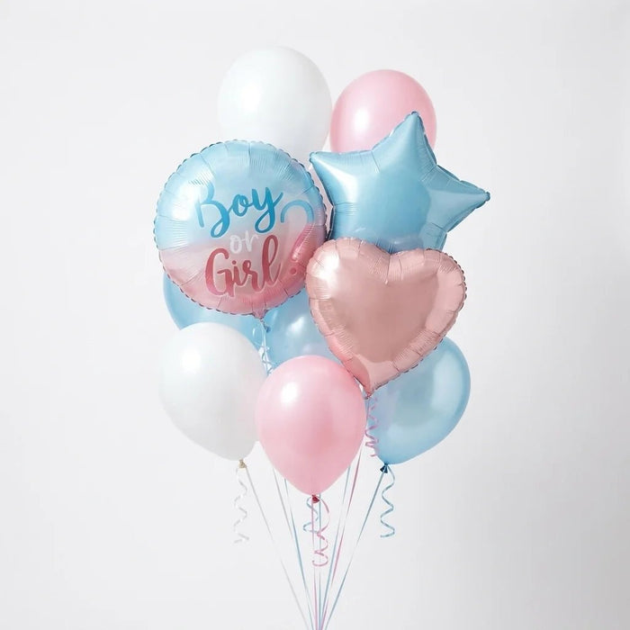 Gender reveal balloon bouquet featuring a round “Boy or Girl?” foil balloon, a light blue star-shaped foil balloon, a pastel pink heart-shaped foil balloon, and pink, light blue, and white latex balloons with curling ribbons.