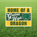 Sign with 'Home of a Gretna High Dragon' on a grass background