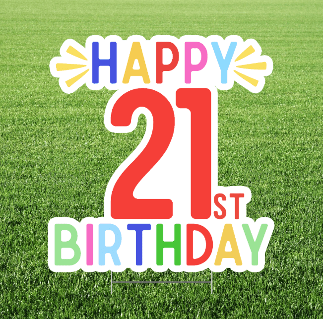 Happy 21st birthday yard sign featuring large red “21” text with colorful “Happy Birthday” lettering on a white cutout sign displayed in grass.