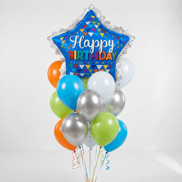 Birthday balloon bouquet featuring a blue star-shaped “Happy Birthday” foil balloon with colorful triangle patterns and a ruffled edge plus orange, lime green, bright blue, white, and silver latex balloons with curling ribbons.