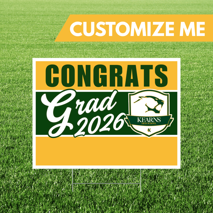 Graduation-themed sign with 'Congrats Grad 2026' on a grass background