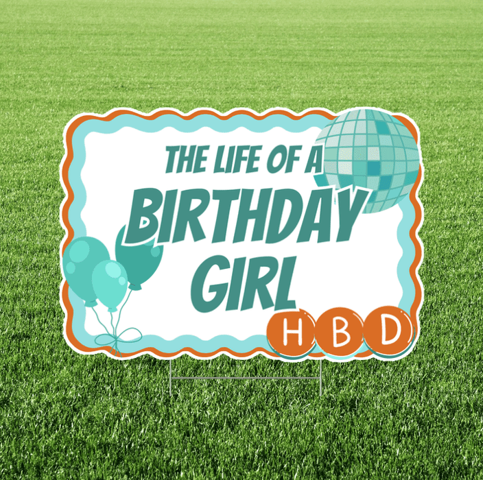 Birthday-themed yard sign with balloons and 'HBD' on a grass background