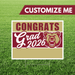 Graduation-themed sign with bear graphic and customizable text on grass background