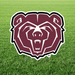 Bear logo on a grass field