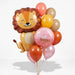 Baby balloon bouquet featuring a smiling lion-shaped foil balloon, a pink “Hello World!” foil balloon, and coral, burnt orange, pink, yellow orange, and tan latex balloons with curling ribbons.