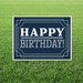Navy “Happy Birthday” yard sign featuring white vintage-style lettering and decorative border lines on a rectangular sign displayed in grass.