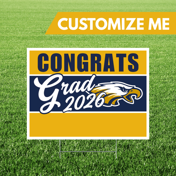 Graduation-themed sign with 'Congrats Grad 2026' and an eagle logo on a grass background.