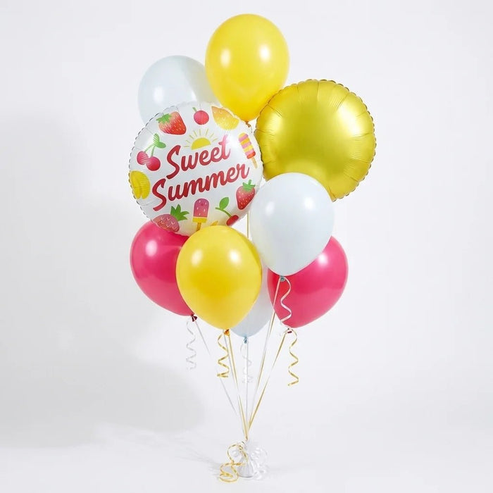 Sweet Summer balloon bouquet featuring a round fruit-patterned “Sweet Summer” foil balloon, a yellow round foil balloon, and yellow, pink, and white latex balloons with curling ribbons.